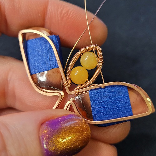 Jennifer Brooks's Rosy Maple Moth Pendant - , Contemporary Wire Jewelry, Lashing, Wire Lashing, Wire Wrapping, Wrapping, Wire Wrapping Jewelry, frame in the center of the tape on both sides.